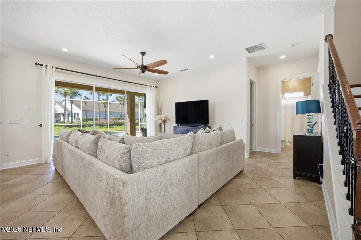 166 Portside Avenue Ponte Vedra, FL 32081 - Photo 10 of 46 a living room with furniture and a flat screen tv