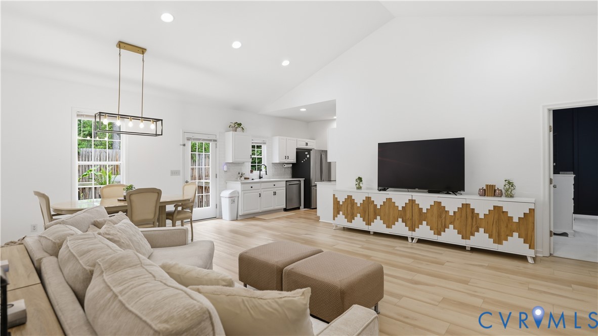 2406 Emanuel Church Road Powhatan, VA 23139 - Photo 6 of 48 Open-concept living area with vaulted ceilings, li