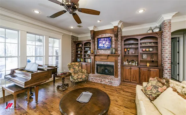 a living room with furniture and a fireplace