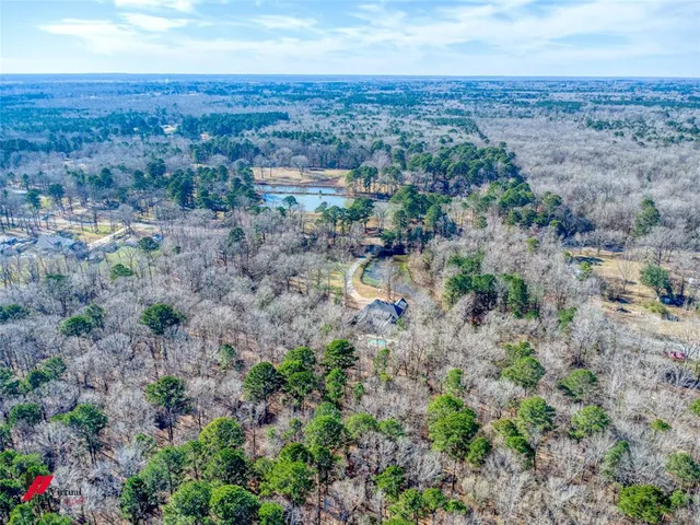 an aerial view of residential house and green space