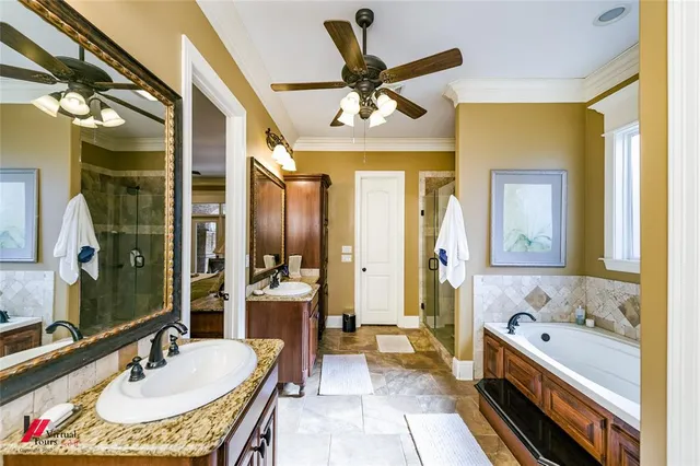 a bathroom with a tub sink and mirror