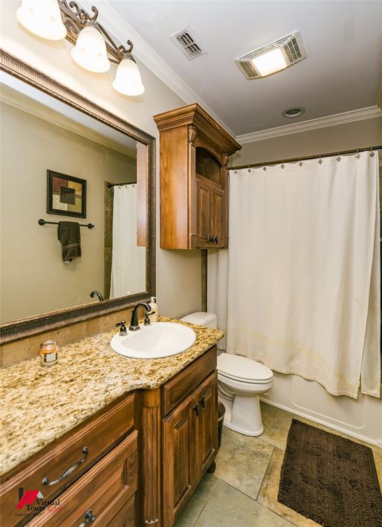 5180 Linton Cutoff Road Benton, LA 71006 - Photo 28 of 40 a bathroom with a granite countertop sink toilet and shower