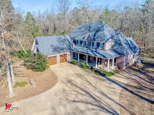 a aerial view of a house with a yard