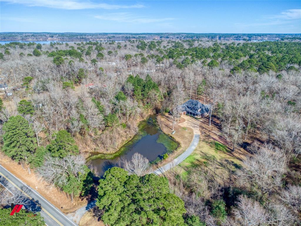 5180 Linton Cutoff Road Benton, LA 71006 - Photo 36 of 40 an aerial view of a house with a yard