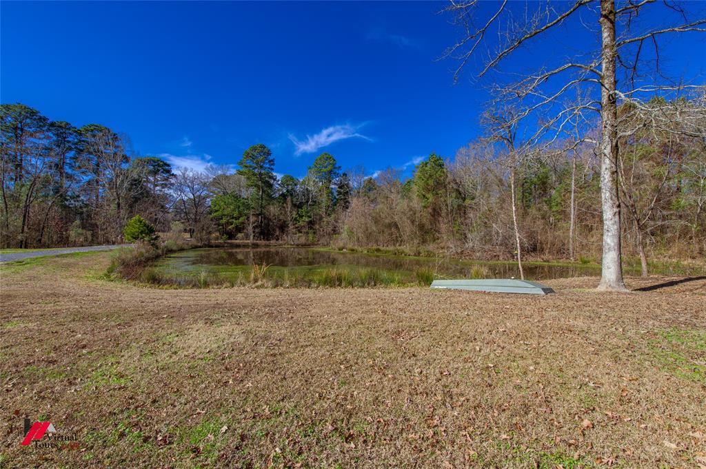 5180 Linton Cutoff Road Benton, LA 71006 - Photo 37 of 40 a view of a yard with an tree