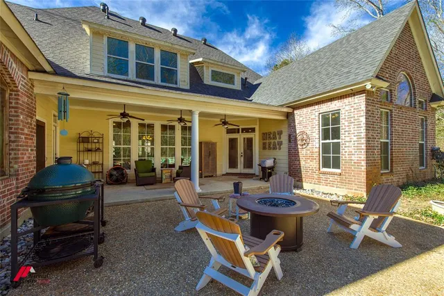 a backyard of a house with outdoor seating