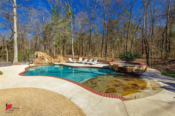 a view of a swimming pool with a bench