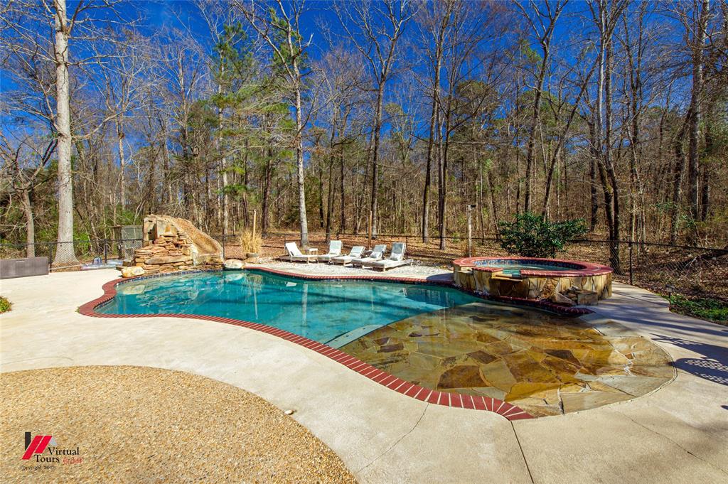 5180 Linton Cutoff Road Benton, LA 71006 - Photo 6 of 40 a view of a swimming pool with a bench