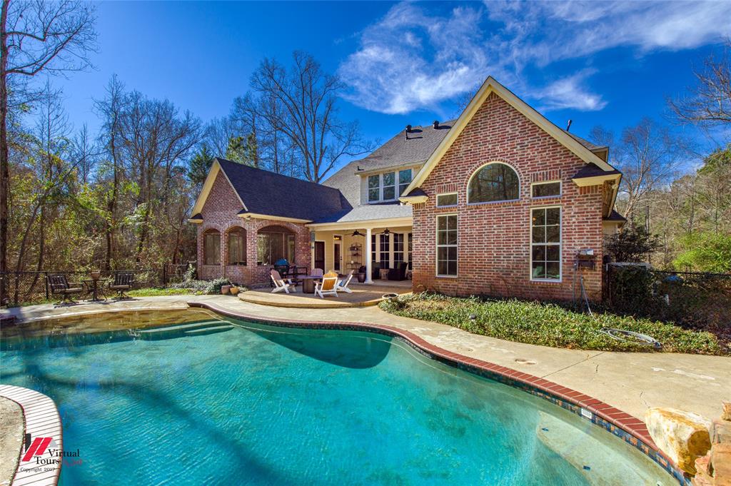 5180 Linton Cutoff Road Benton, LA 71006 - Photo 7 of 40 a front view of a house with swimming pool having outdoor seating
