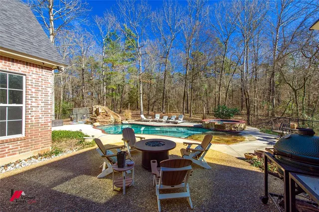 a view of swimming pool with outdoor seating
