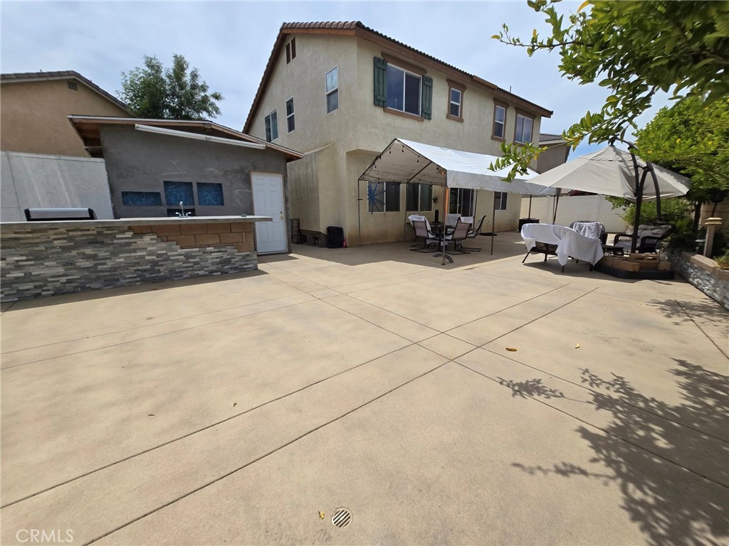 1315 Plaza Way Perris, CA 92570 - Photo 1 of 37 a front view of a house with a yard