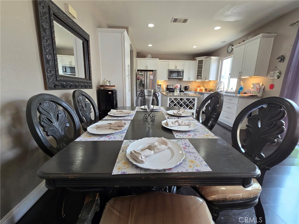1315 Plaza Way Perris, CA 92570 - Photo 11 of 37 a view of a dining room with furniture
