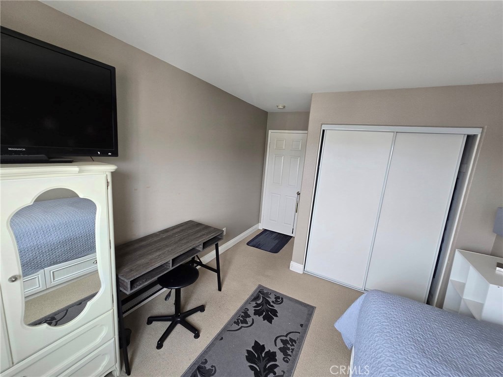 1315 Plaza Way Perris, CA 92570 - Photo 17 of 37 a view of a livingroom with furniture and a flat screen tv