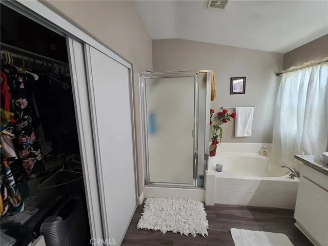 a bathroom with a bathtub and a shower