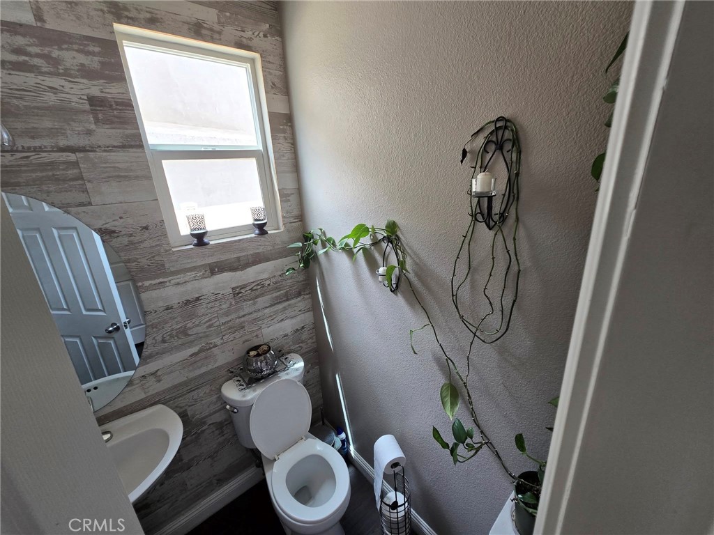 1315 Plaza Way Perris, CA 92570 - Photo 29 of 37 a bathroom with a toilet and a sink