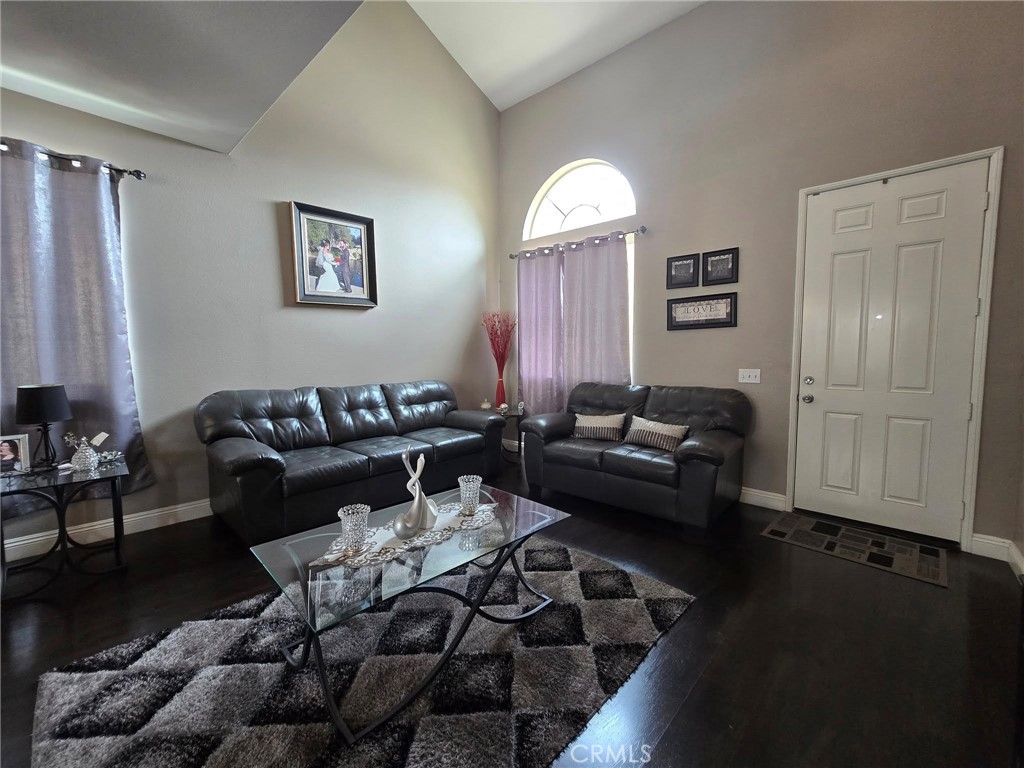 1315 Plaza Way Perris, CA 92570 - Photo 3 of 37 a living room with furniture wooden floor and a window
