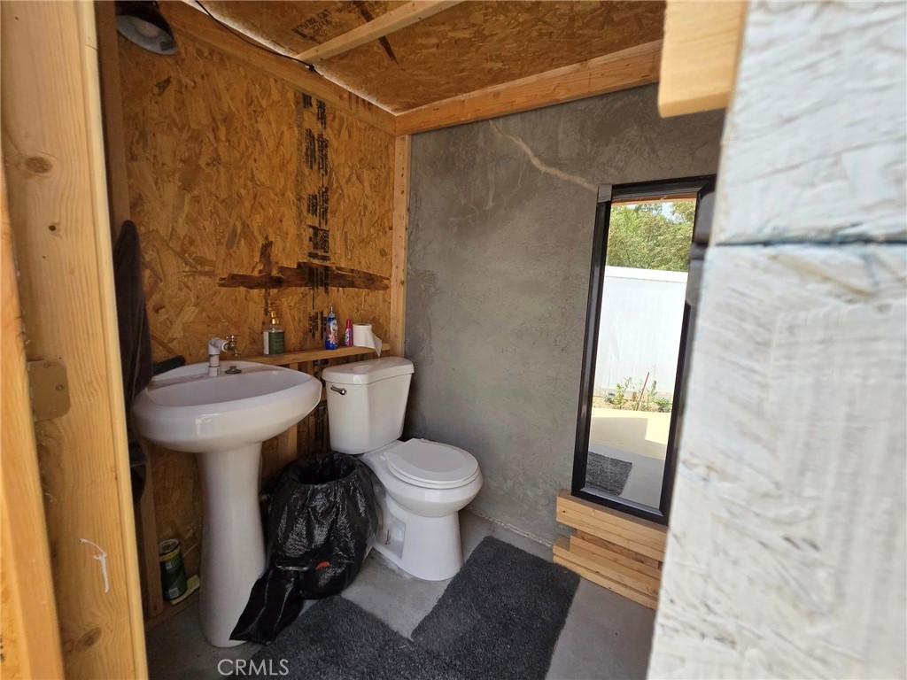 1315 Plaza Way Perris, CA 92570 - Photo 37 of 37 a bathroom with a sink toilet and shower