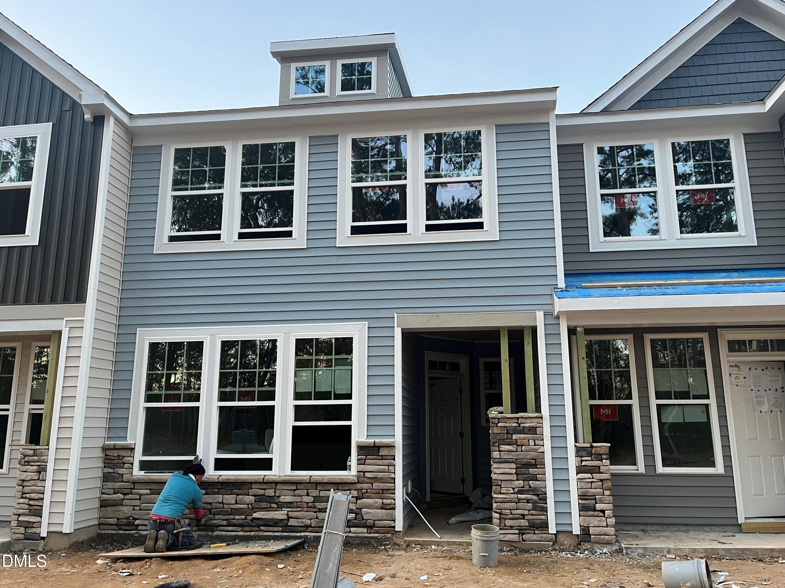 6423 Granite Quarry Drive Raleigh, NC 27610 - Photo 1 of 49 front view of a brick house with large windows