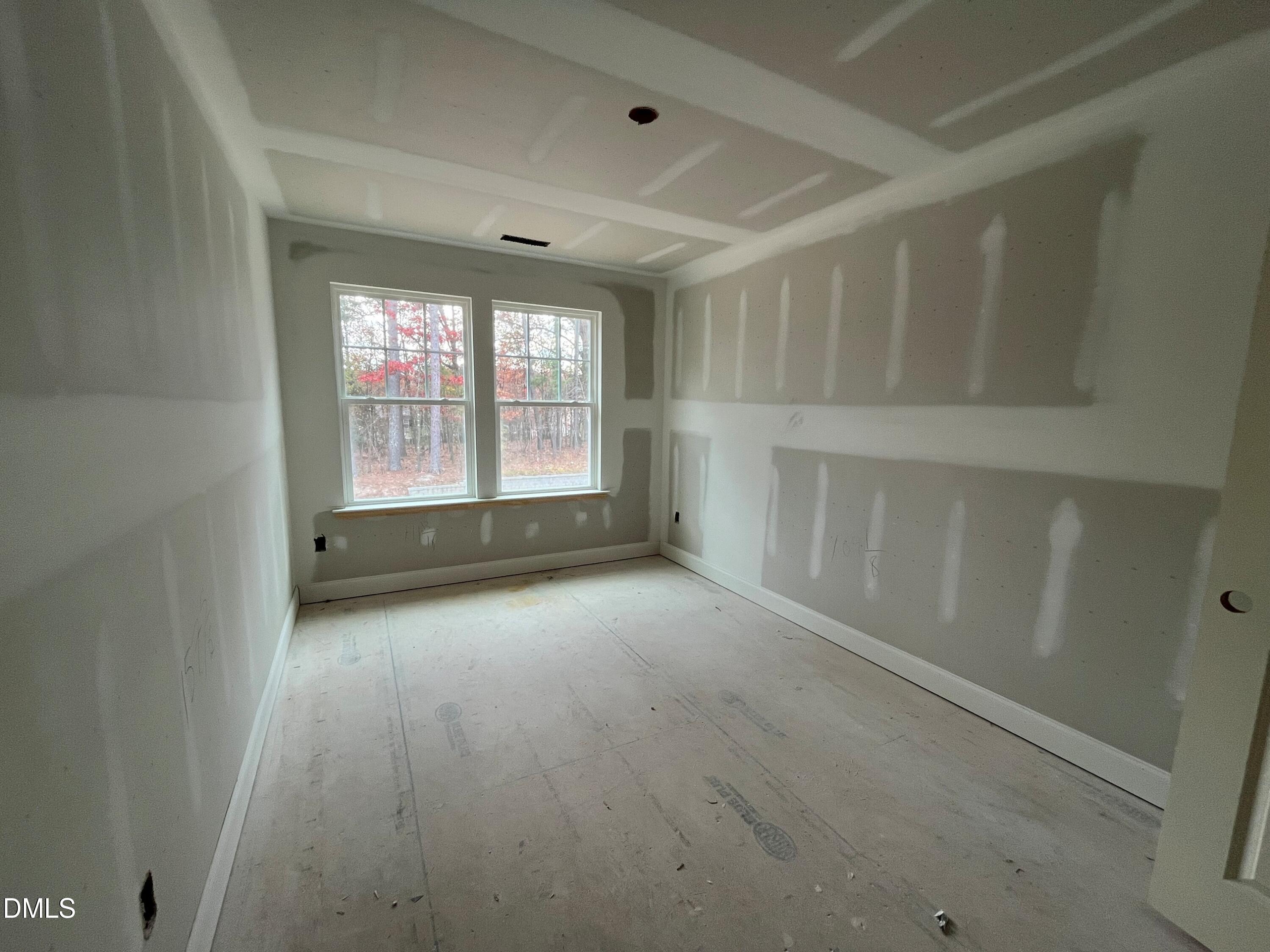 6423 Granite Quarry Drive Raleigh, NC 27610 - Photo 13 of 49 a view of an empty room with a window