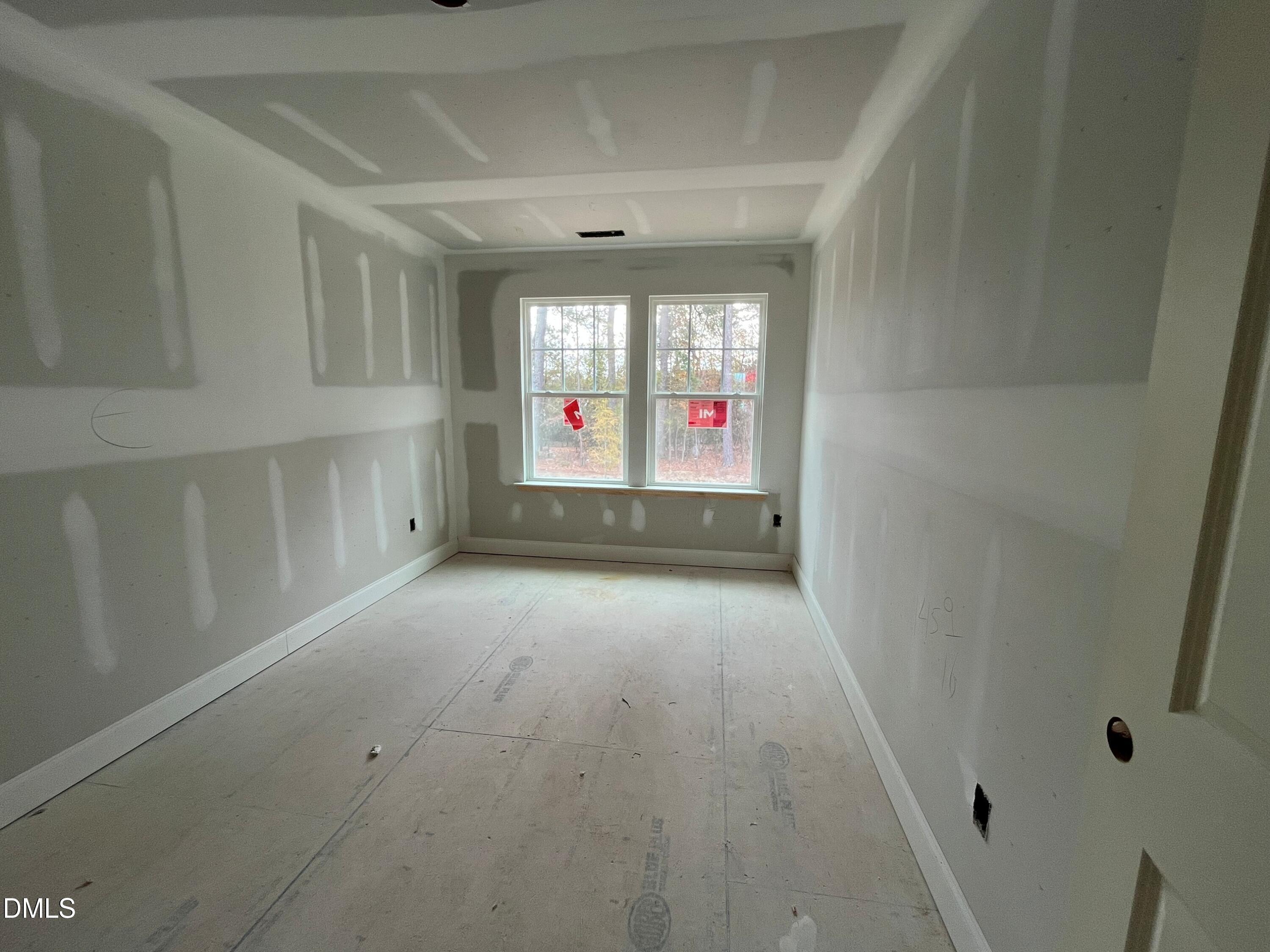 6423 Granite Quarry Drive Raleigh, NC 27610 - Photo 14 of 49 a view of empty room with windows