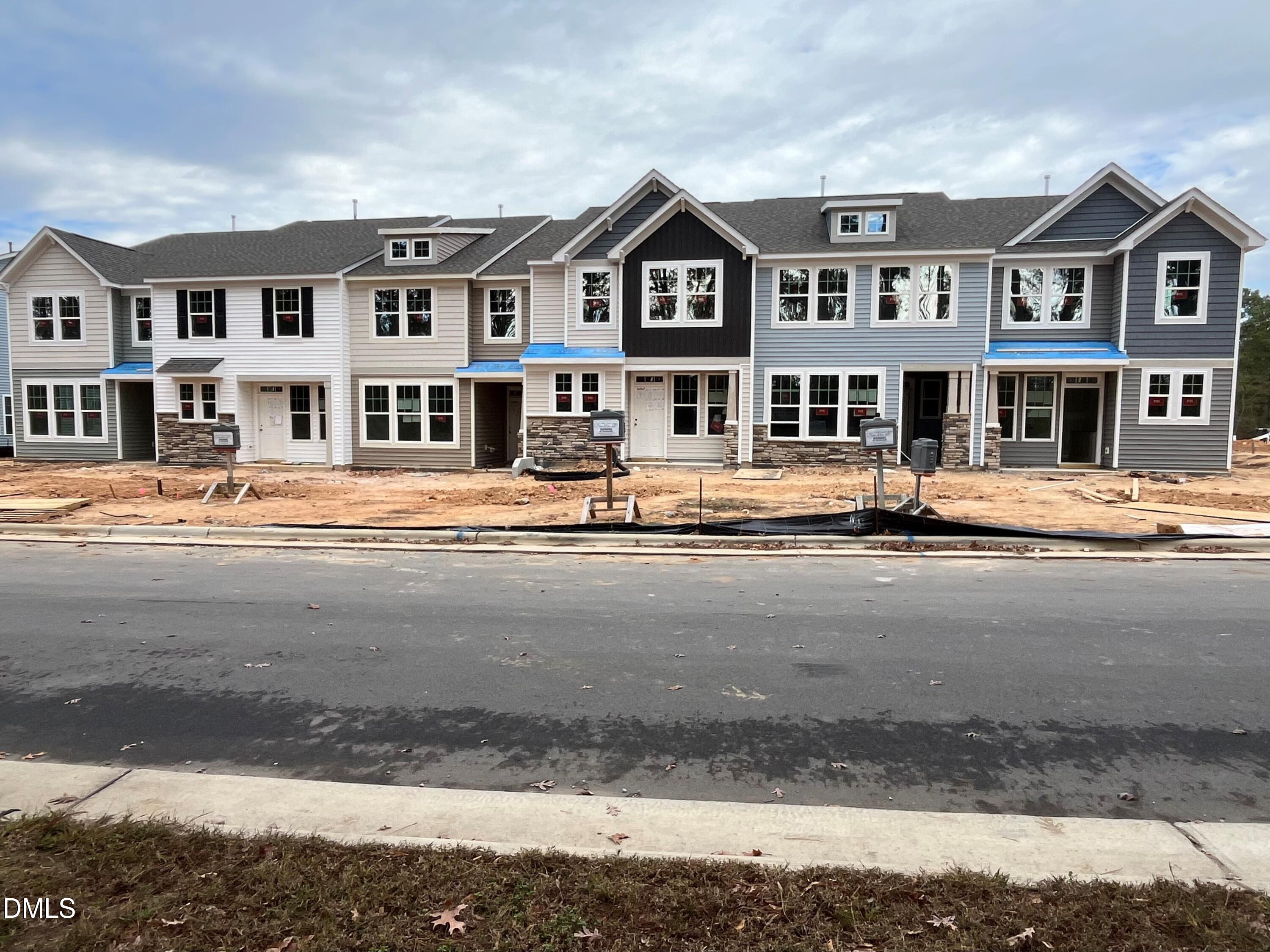 6423 Granite Quarry Drive Raleigh, NC 27610 - Photo 2 of 49 a front view of a building with a street