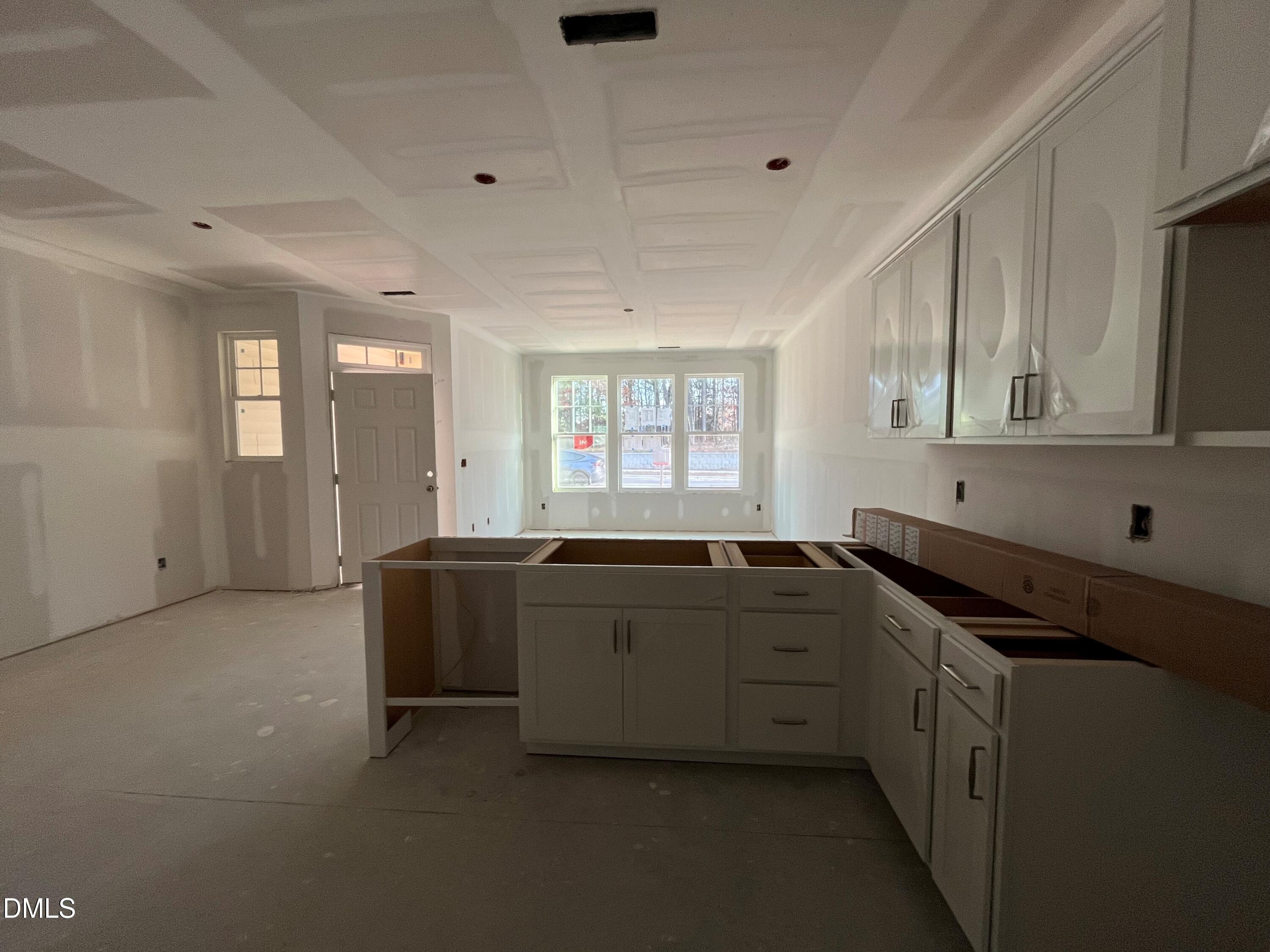 6423 Granite Quarry Drive Raleigh, NC 27610 - Photo 3 of 49 a spacious bathroom with a granite countertop sink a mirror and a bathtub