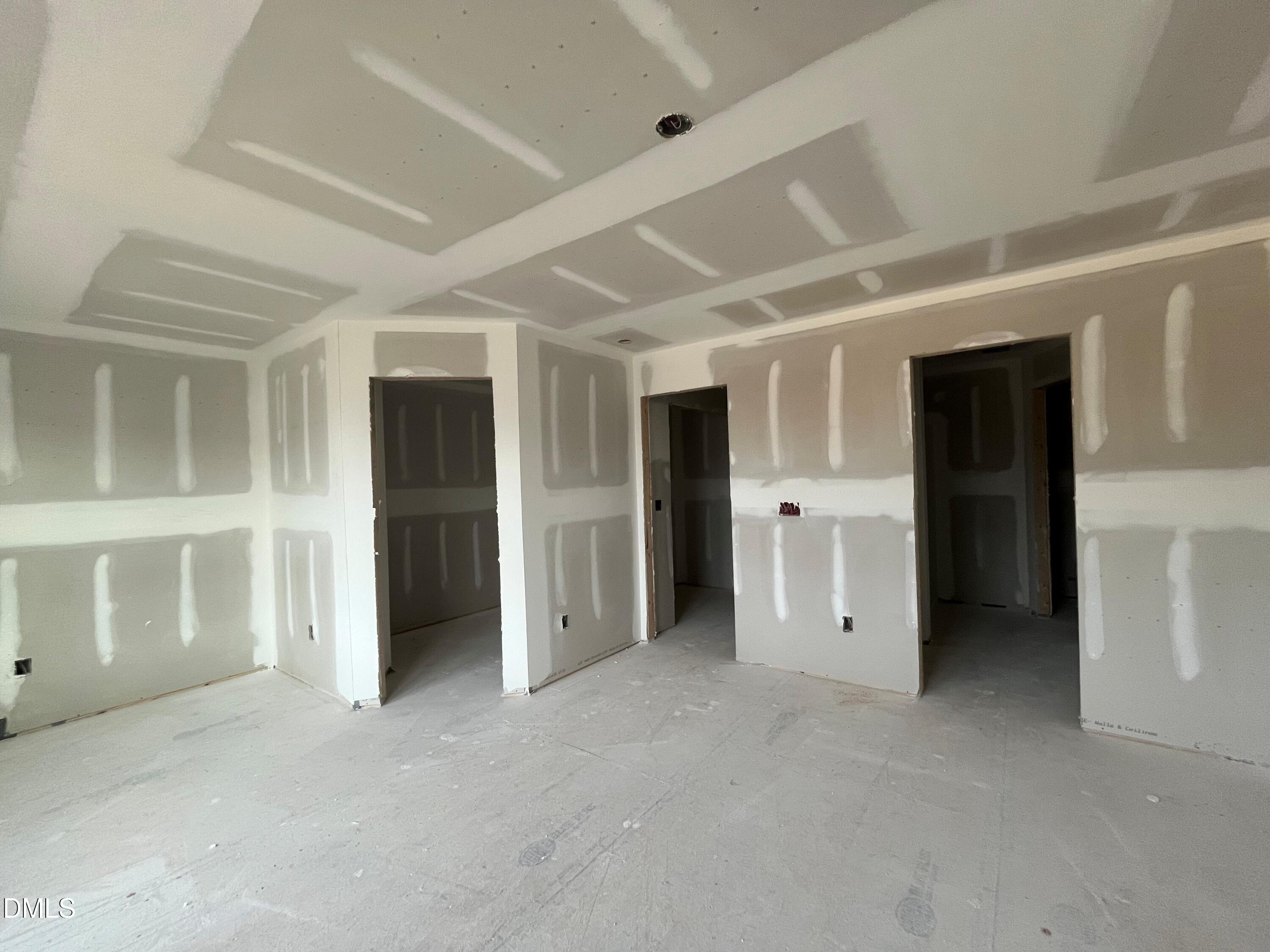 6423 Granite Quarry Drive Raleigh, NC 27610 - Photo 8 of 49 a view of an empty room with a window