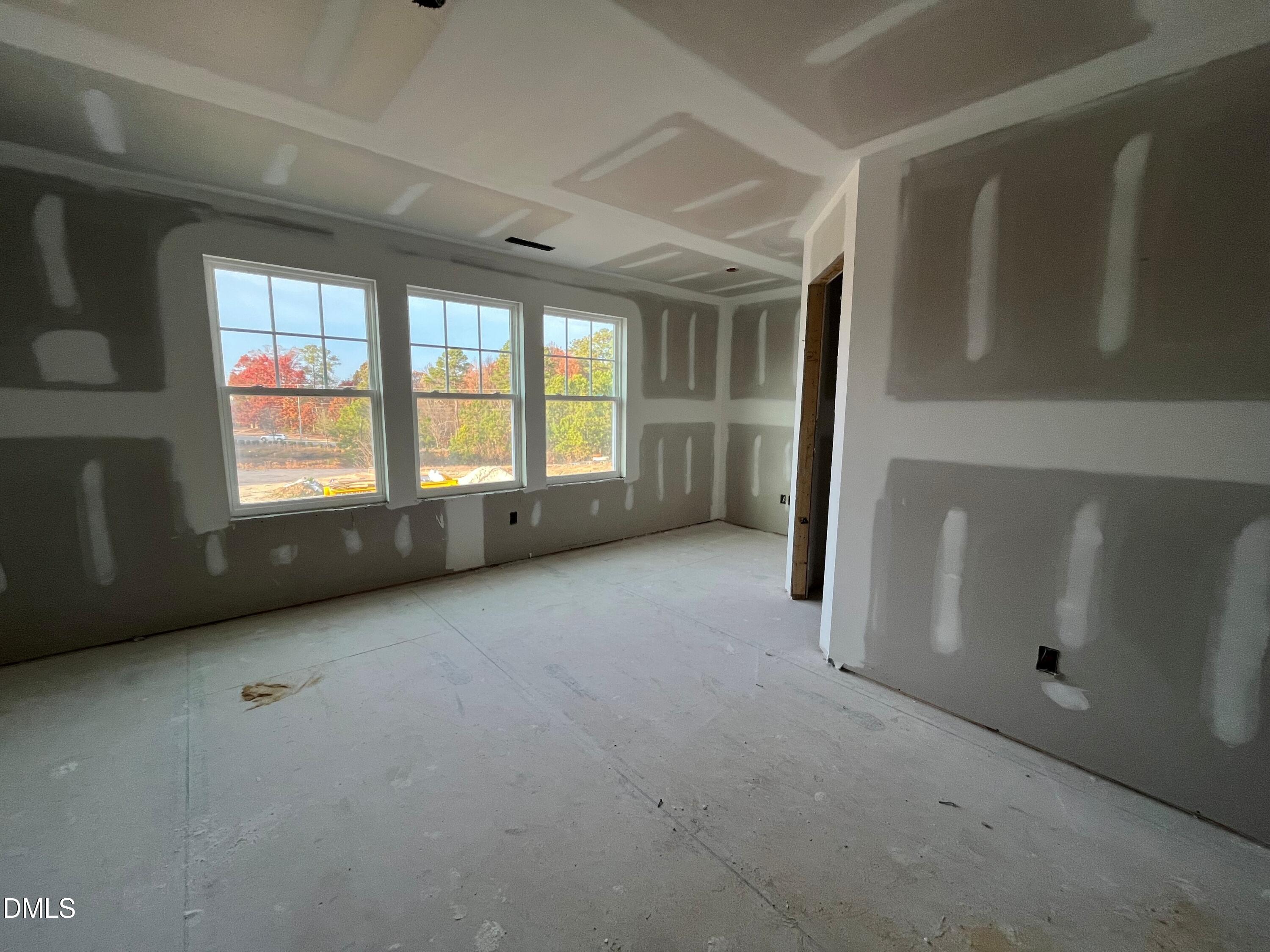 6423 Granite Quarry Drive Raleigh, NC 27610 - Photo 10 of 49 a view of an empty room with a window