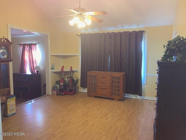 747 Gose Road Forsyth, GA 31029 - Photo 5 of 15 an empty room with windows and closet