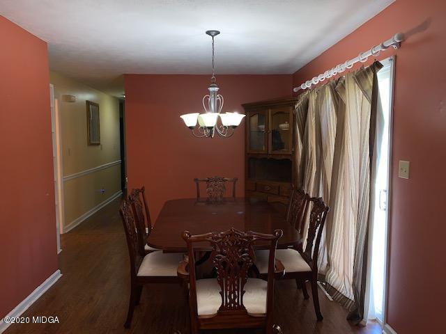 747 Gose Road Forsyth, GA 31029 - Photo 6 of 15 a view of a dining room with furniture and window