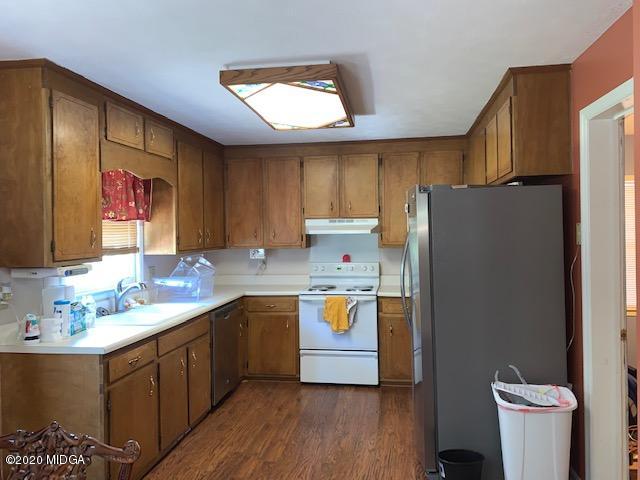 747 Gose Road Forsyth, GA 31029 - Photo 7 of 15 a kitchen with a sink appliances and cabinets
