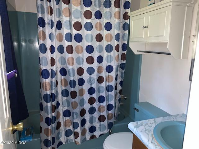 747 Gose Road Forsyth, GA 31029 - Photo 9 of 15 a bathroom with a sink toilet and shower