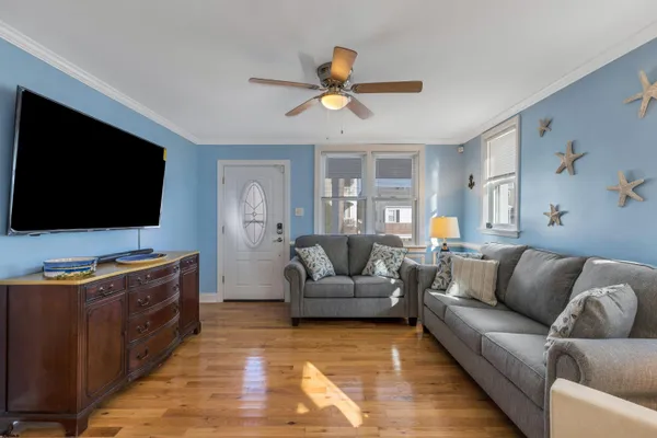 a living room with furniture and a flat screen tv