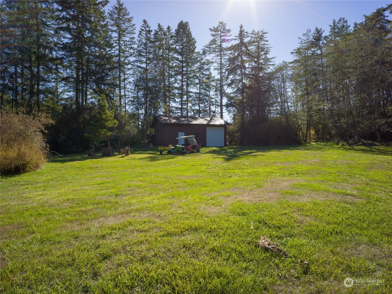 165 Sunrise Road Lopez Island, WA 98261 - Photo 6 of 12 a view of a swimming pool with an outdoor space and seating area