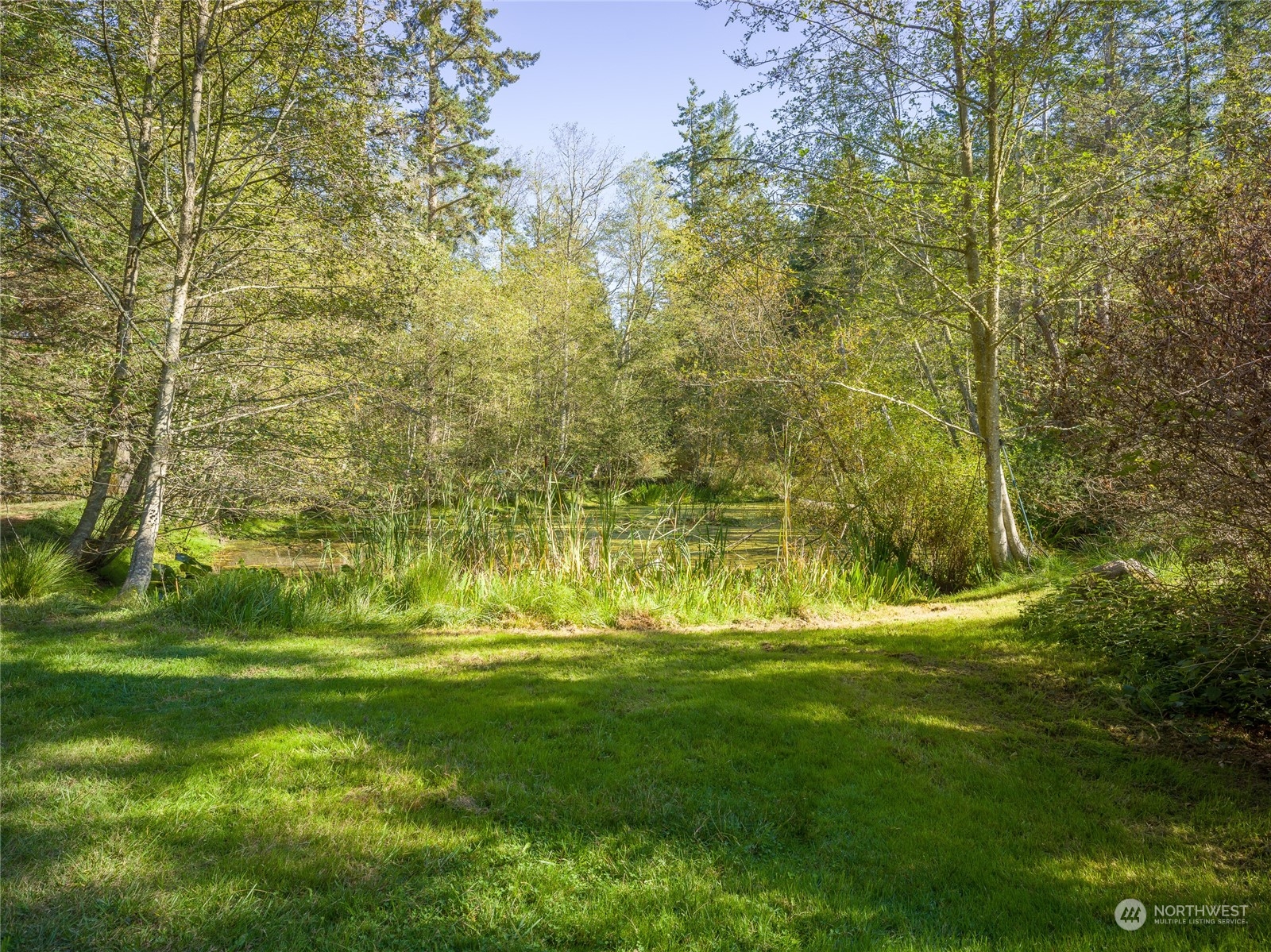 165 Sunrise Road Lopez Island, WA 98261 - Photo 10 of 12 a view of a pool with a garden