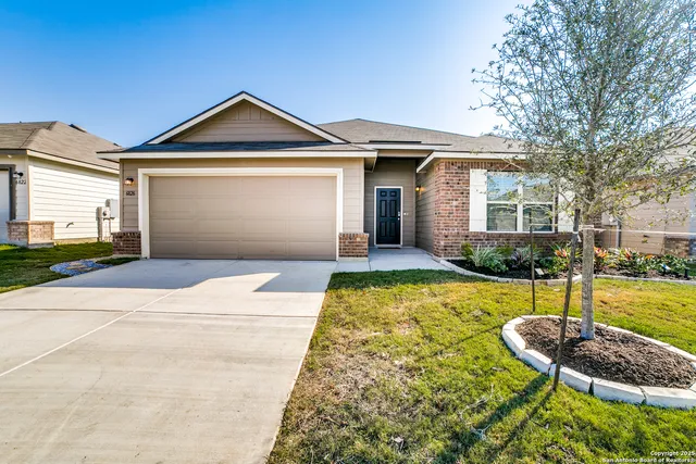 a front view of a house with swimming pool and glass windows