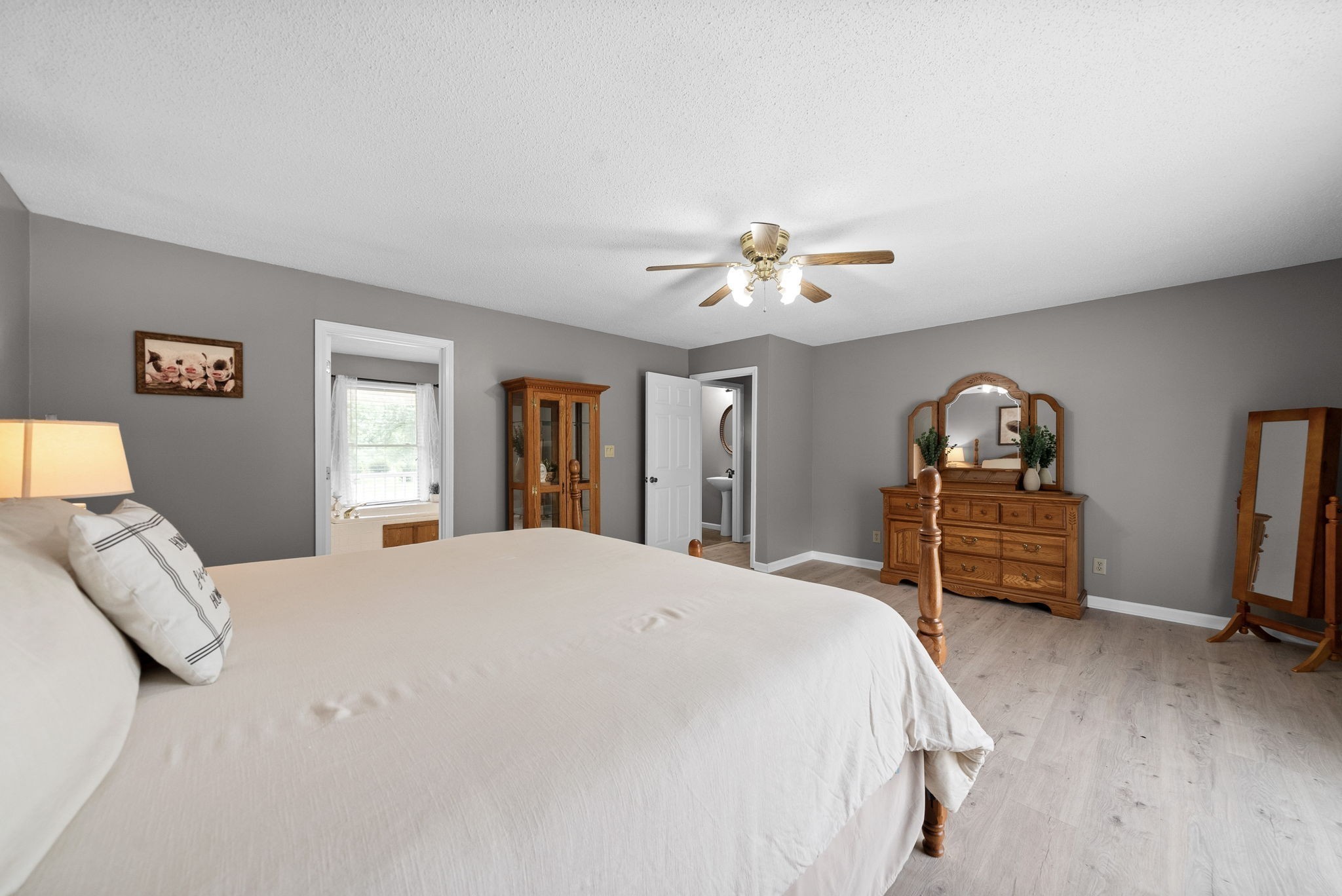 2430 Underwood Road Cunningham, TN 37052 - Photo 18 of 49 a bedroom with a bed and a chandelier