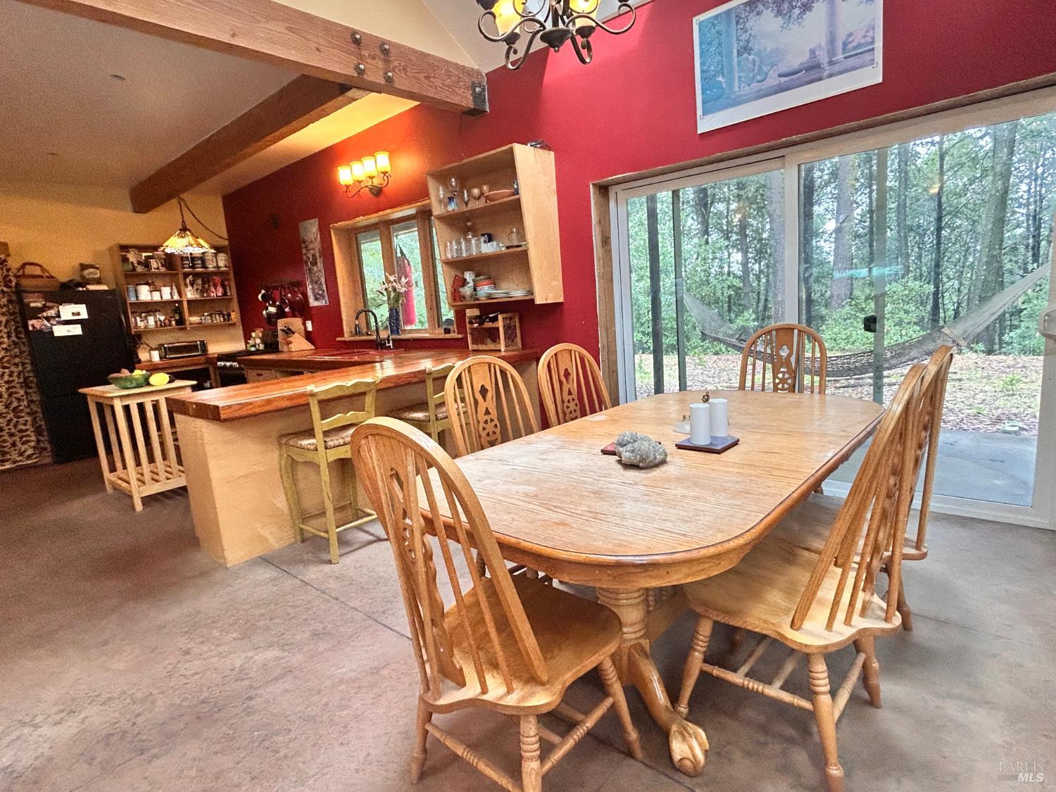 29281 Timberline Road Willits, CA 95490 - Photo 12 of 38 a dining room with furniture a large window and kitchen view