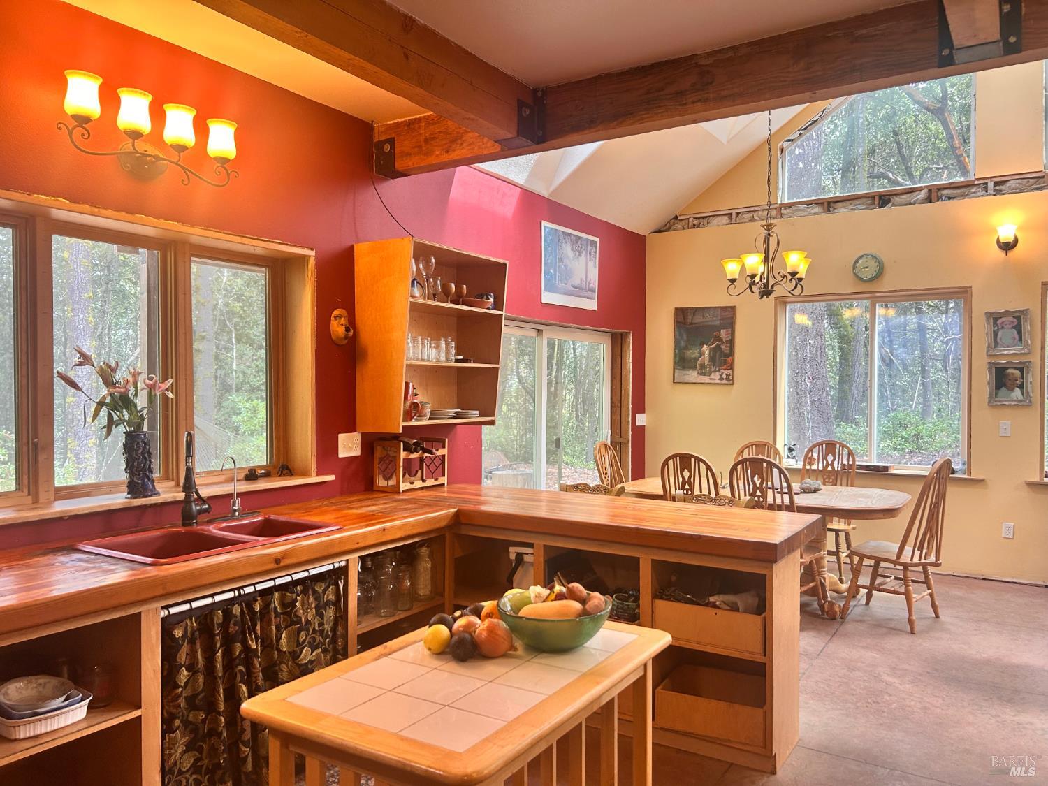 29281 Timberline Road Willits, CA 95490 - Photo 17 of 38 a kitchen with a table chairs and a stove