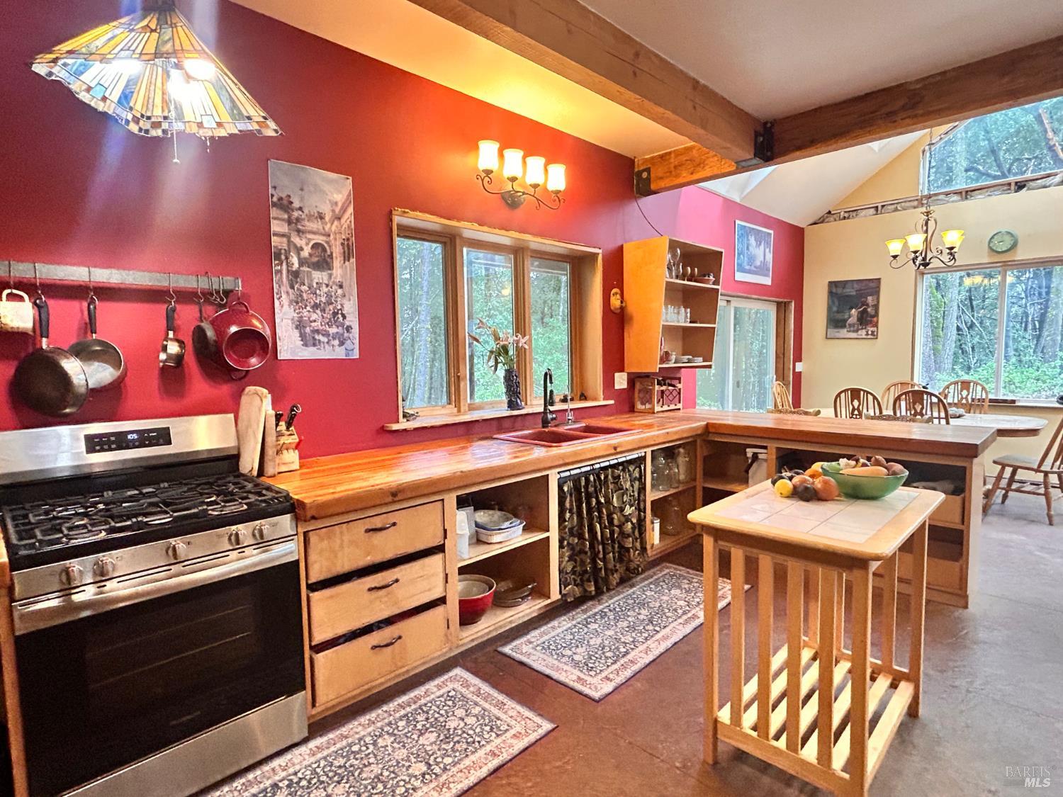 29281 Timberline Road Willits, CA 95490 - Photo 2 of 38 a kitchen with stainless steel appliances granite countertop a stove a sink and a microwave