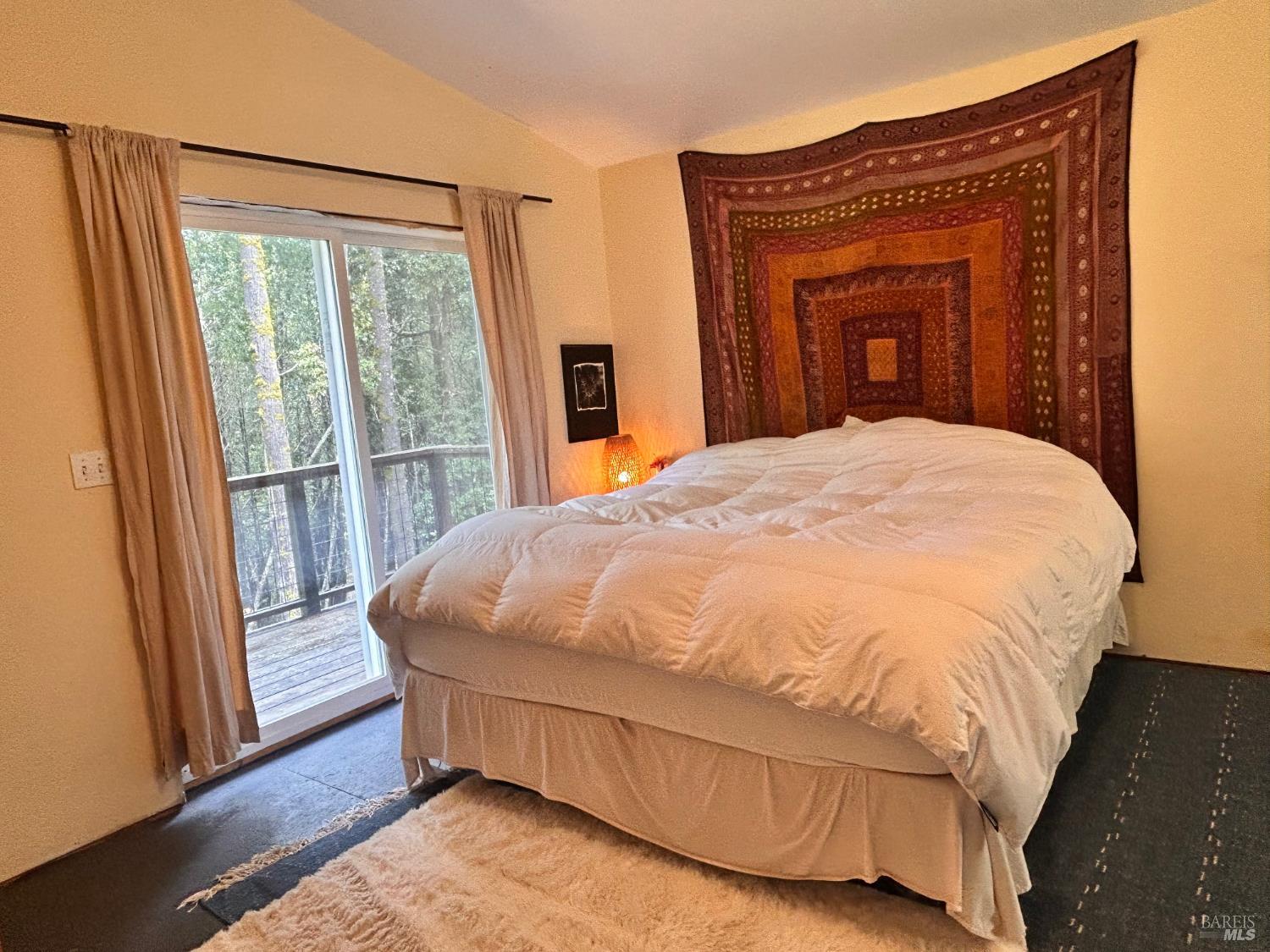 29281 Timberline Road Willits, CA 95490 - Photo 24 of 38 a bed sitting in a bedroom next to a window