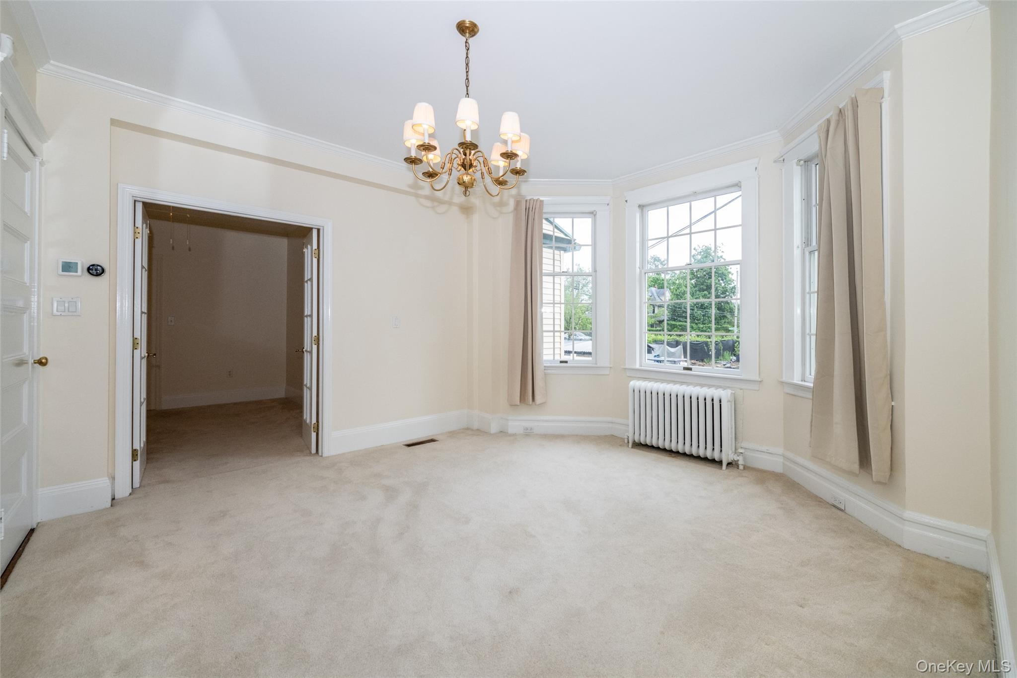 82 Clove Road New Rochelle, NY 10801 - Photo 6 of 39 a view of an empty room with a window