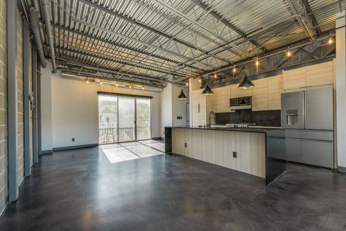 4801 South Congress Avenue, Unit S3 Austin, TX 78745 - Photo 40 of 40 a view of a kitchen with a sink and cabinets