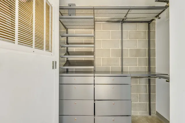 a bathroom with a glass door shower