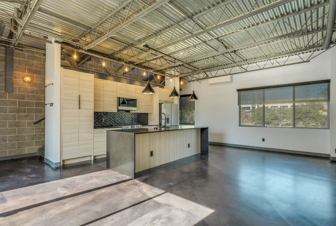 4801 South Congress Avenue, Unit S3 Austin, TX 78745 - Photo 2 of 40 a kitchen with a sink and cabinets