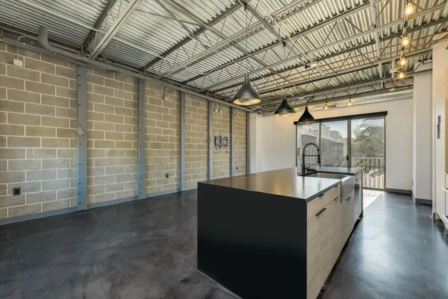 a kitchen with a sink and cabinets