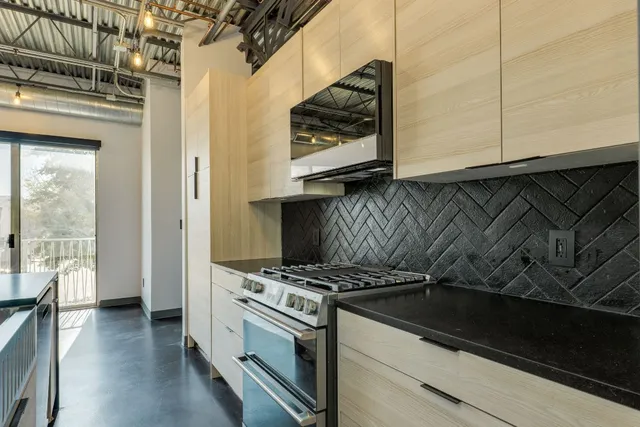 a kitchen with a refrigerator and a sink