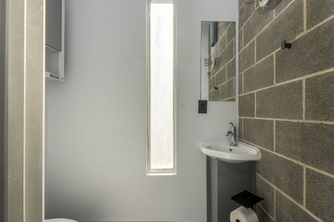 4801 South Congress Avenue, Unit S3 Austin, TX 78745 - Photo 9 of 40 a bathroom with a sink toilet and shower