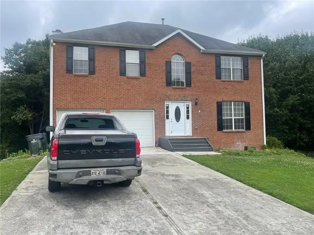 a car parked in front of a house