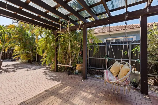 a view of outdoor space with wooden floor